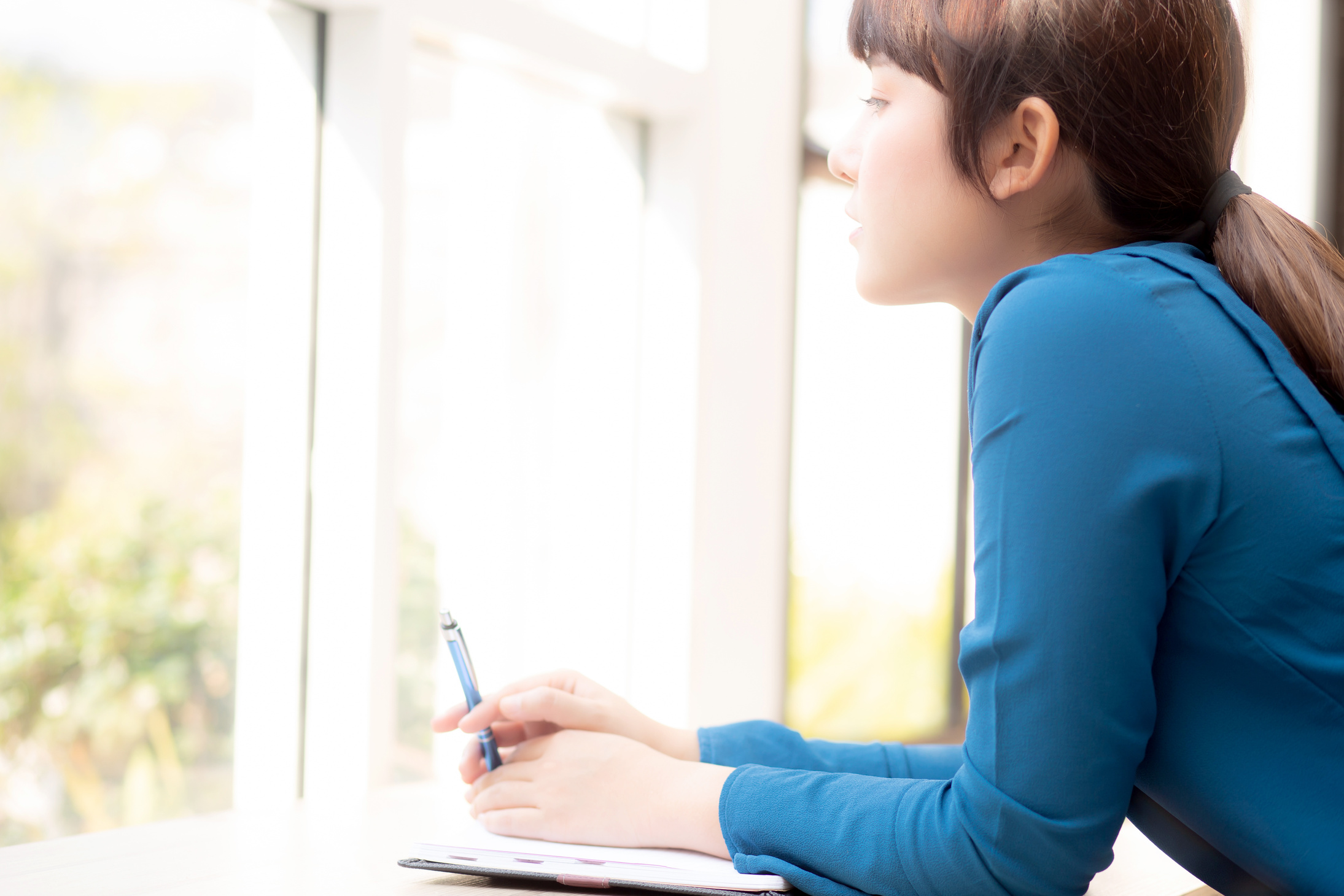 Female Writer Looking Outside the Window